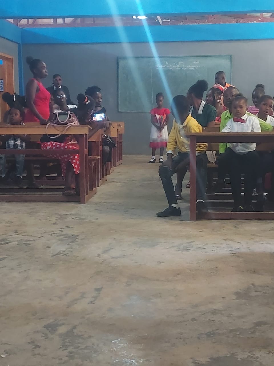 Families and community members gathered in the classroom during the Georgette Beauvais School closing ceremony